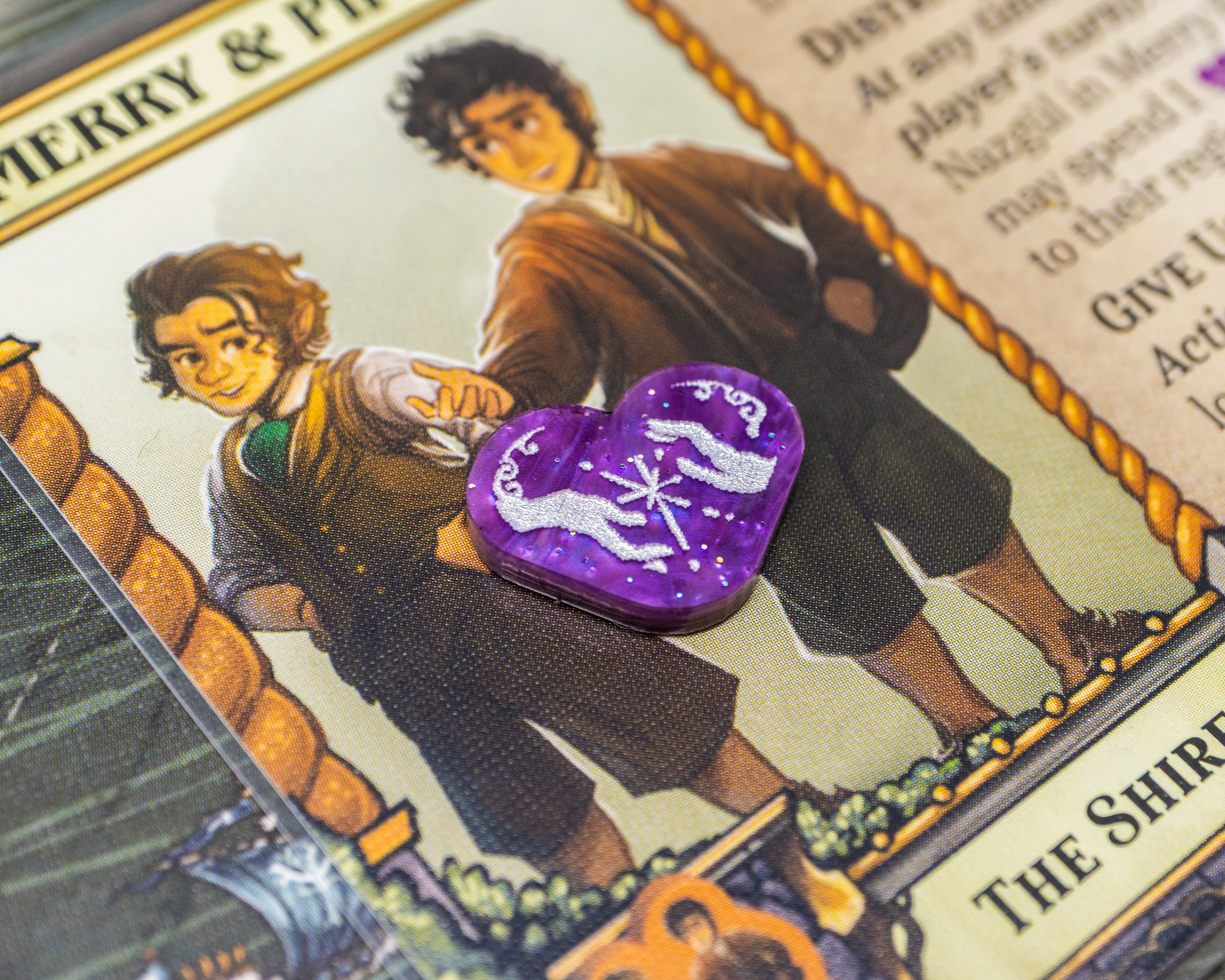 Two hands forming a spark painted white on purple marble acrylic represent Friendship.