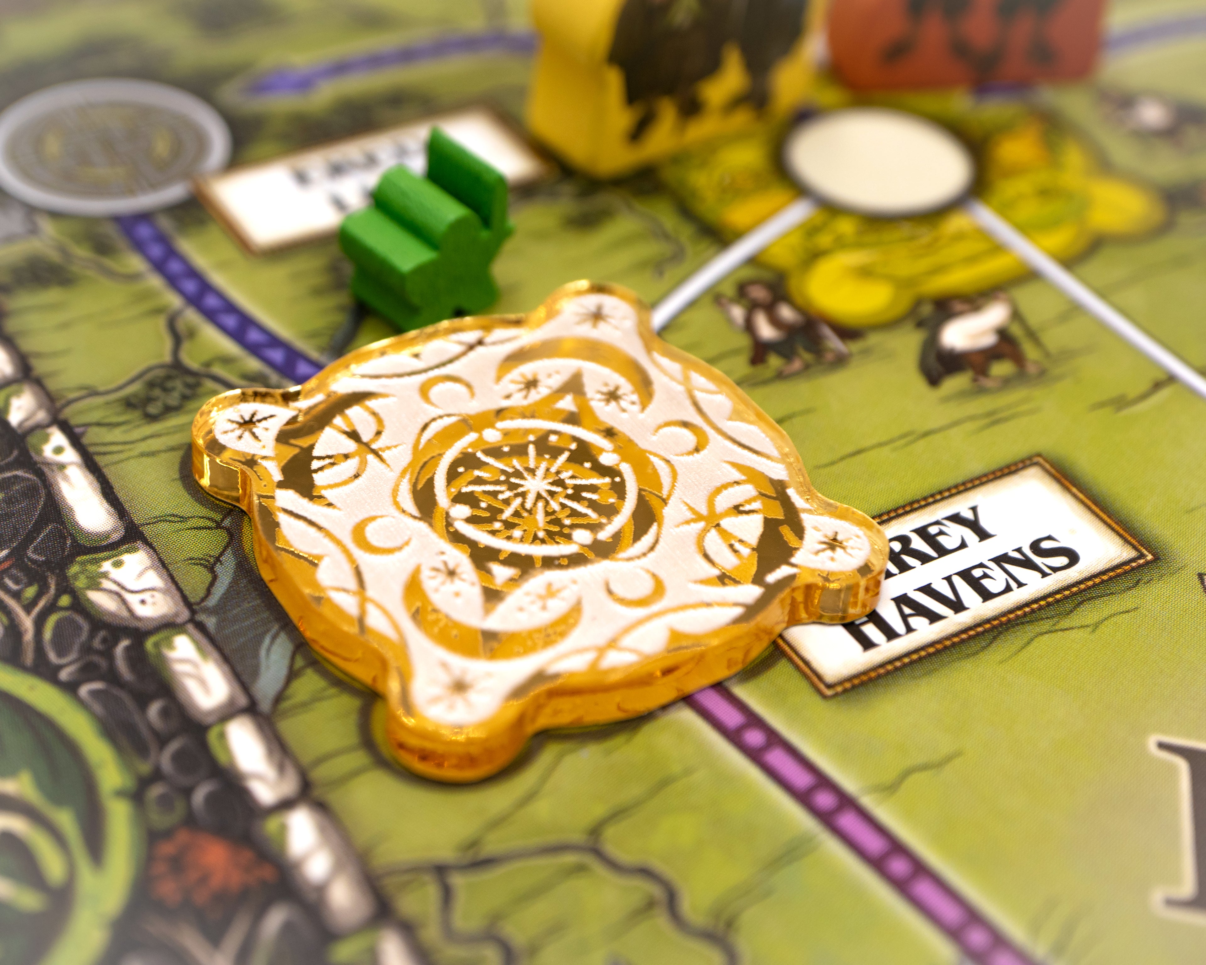 Sun design painted white on gold mirror represents Haven.