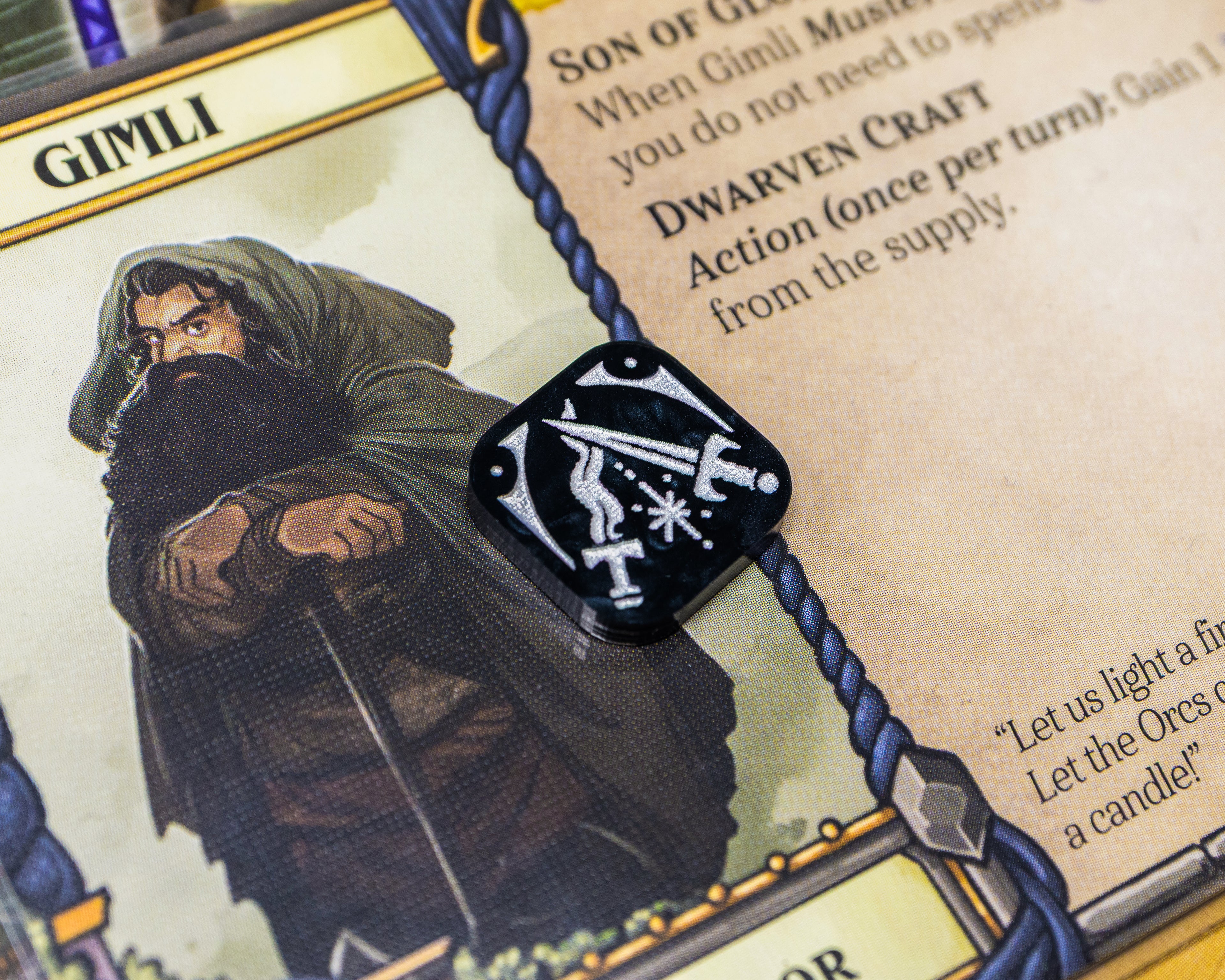 Two daggers clashing and creating sparks painted white on black marble represent Valor.